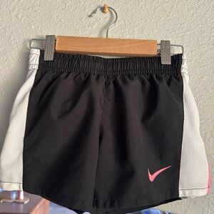 Nike Women's Black and White Athletic Shorts with Pink Swoosh